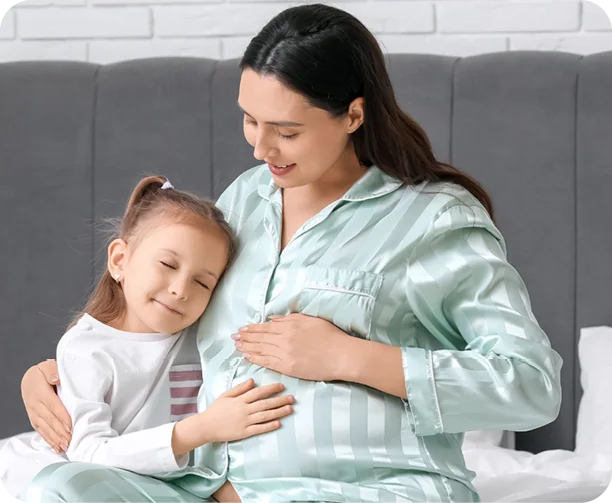 Pregnant Woman next to a Child